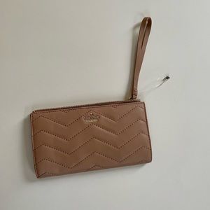 Brand new tan Kate Spade wristlet wallet with beautiful stitching.